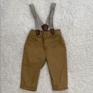 Baby boy’s Osh Kosh tan pants with suspenders.